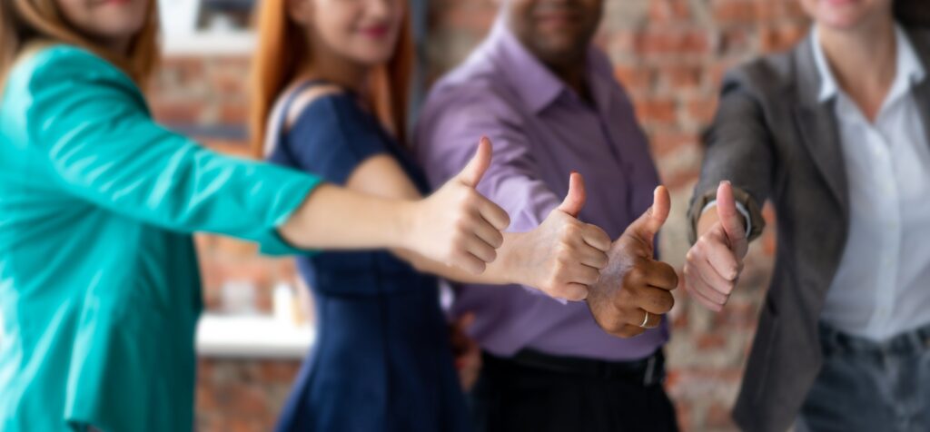 people do the thumbs up as a sign of agreement for conformity
