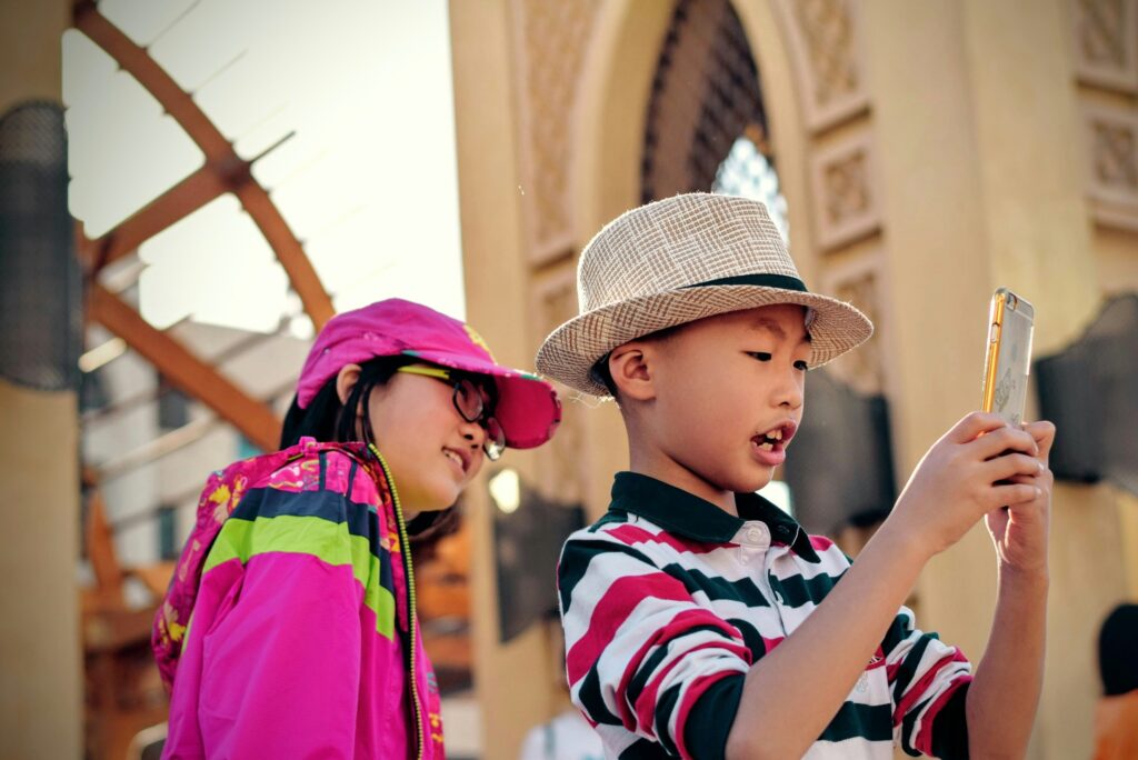 a tourist kids playing on the smartphone
